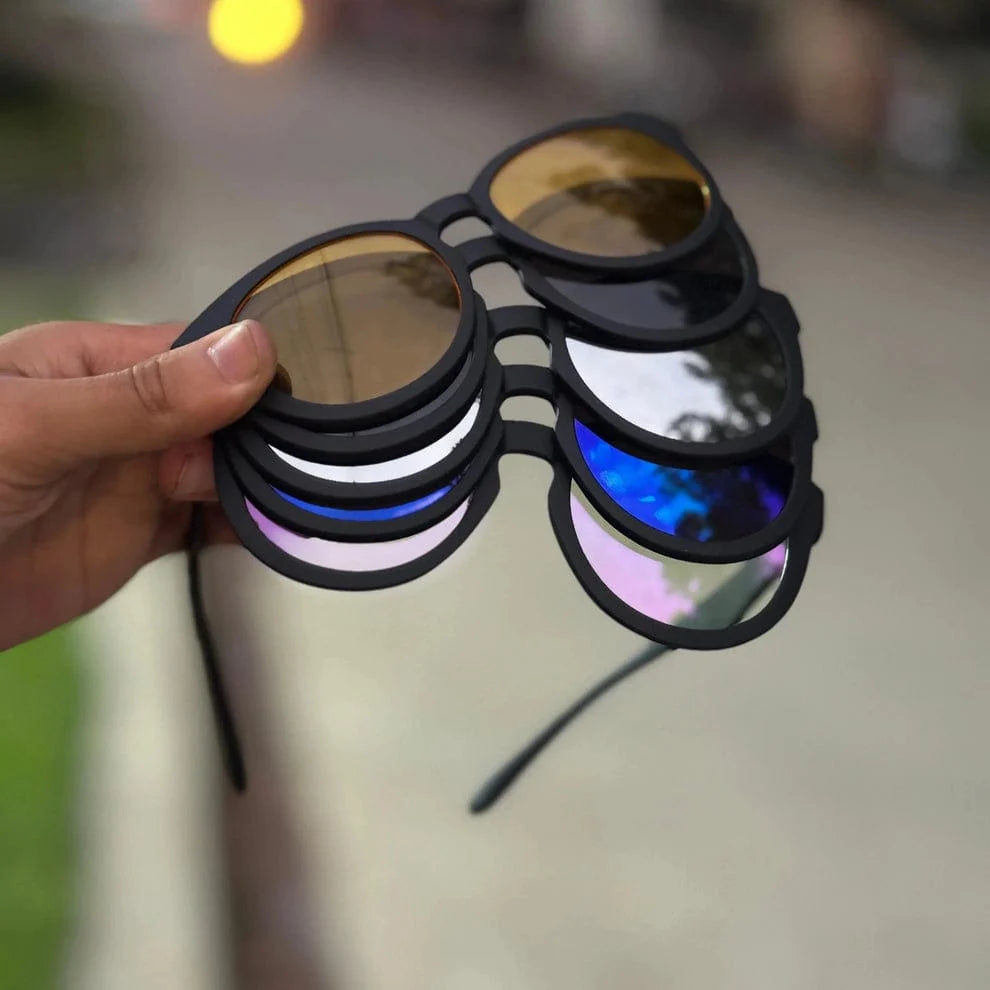 HUNA magnetic clip-on lens set shown stacked in hand